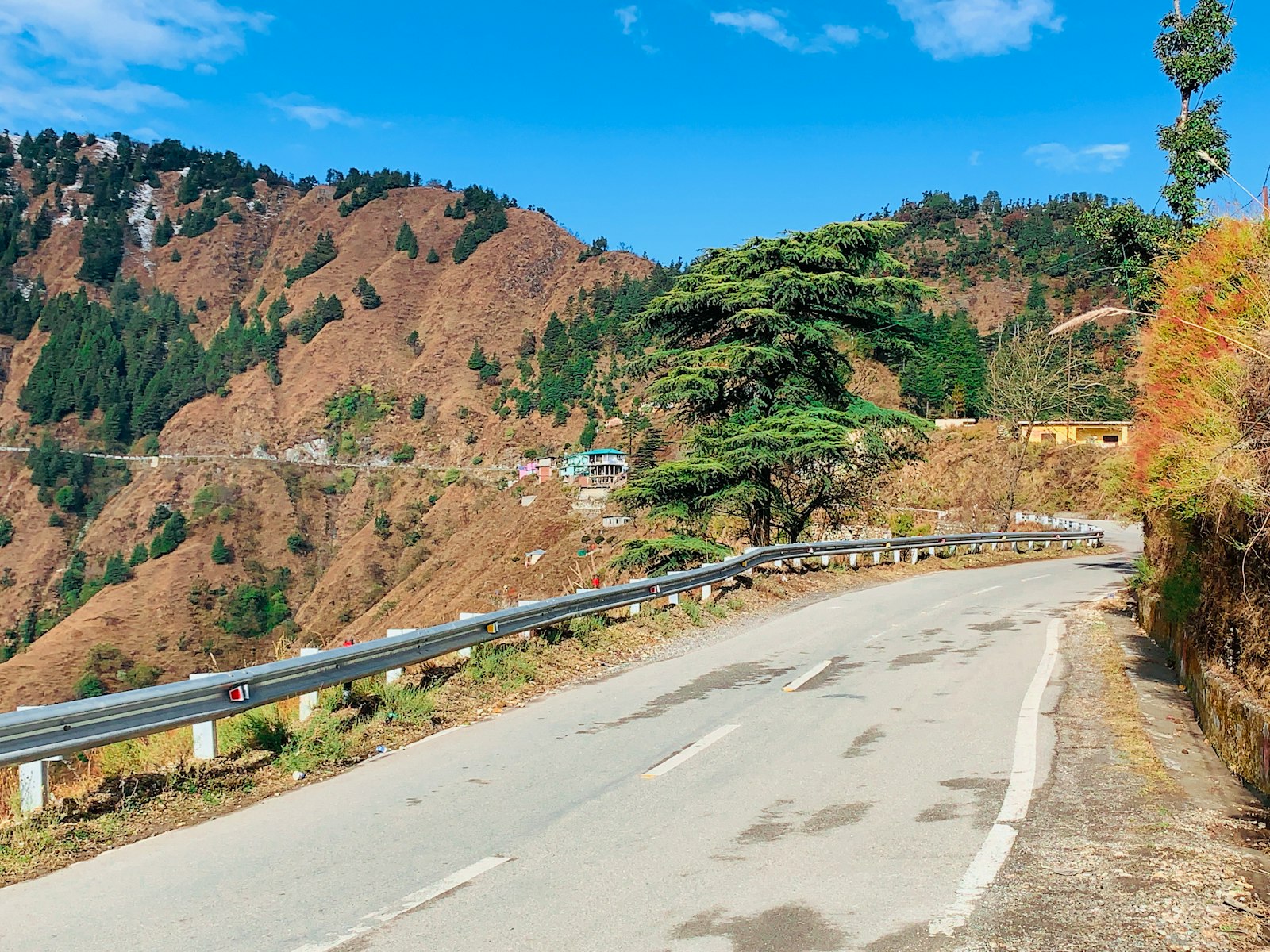 A road winding through the Uttarakhand hills